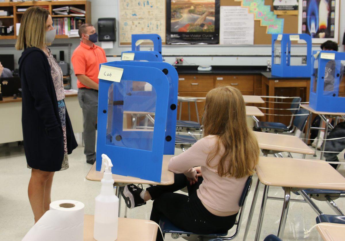 Principal Kristin Robbins and Assistant Principal Craig McMillen talk to freshmen during the Focus on Freshman Programming held during study halls. (Photo by Emma Magee)