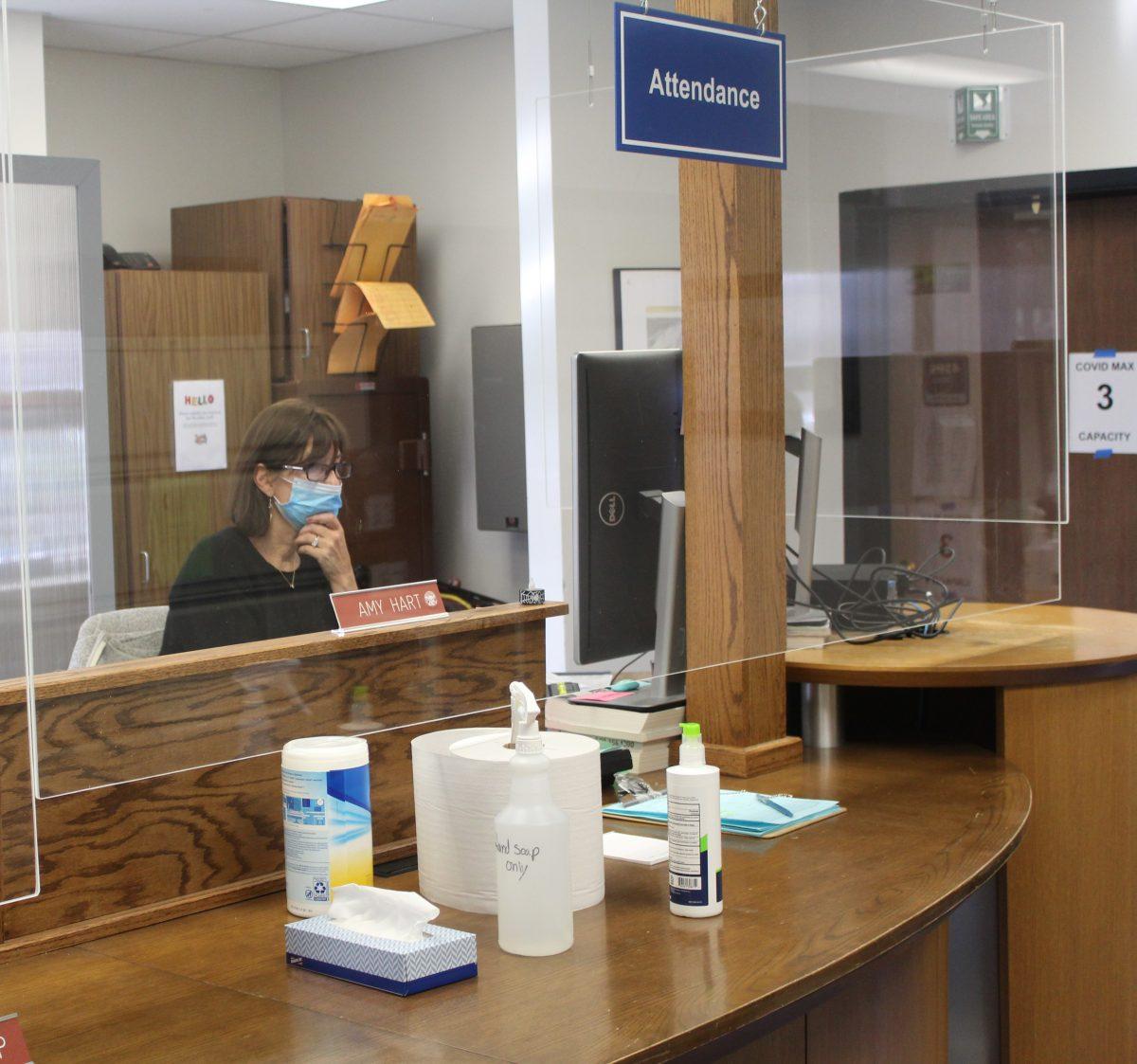 Attendance Secretary Amy Hart sorts through virtual planned absence forms. (Photo by Katie Jude)