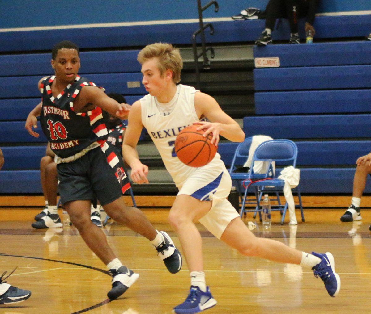 Junior Henry Brandt dribbles towards the basket during a game against Eastmoor Academy. (Photo by Emma Magee)