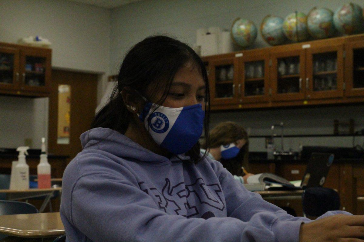 Freshman Naomy Salazar wears one of the new masks distributed by the district, that have a 90% PPE, Tuesday, March 23. (Photo by Emma Magee)