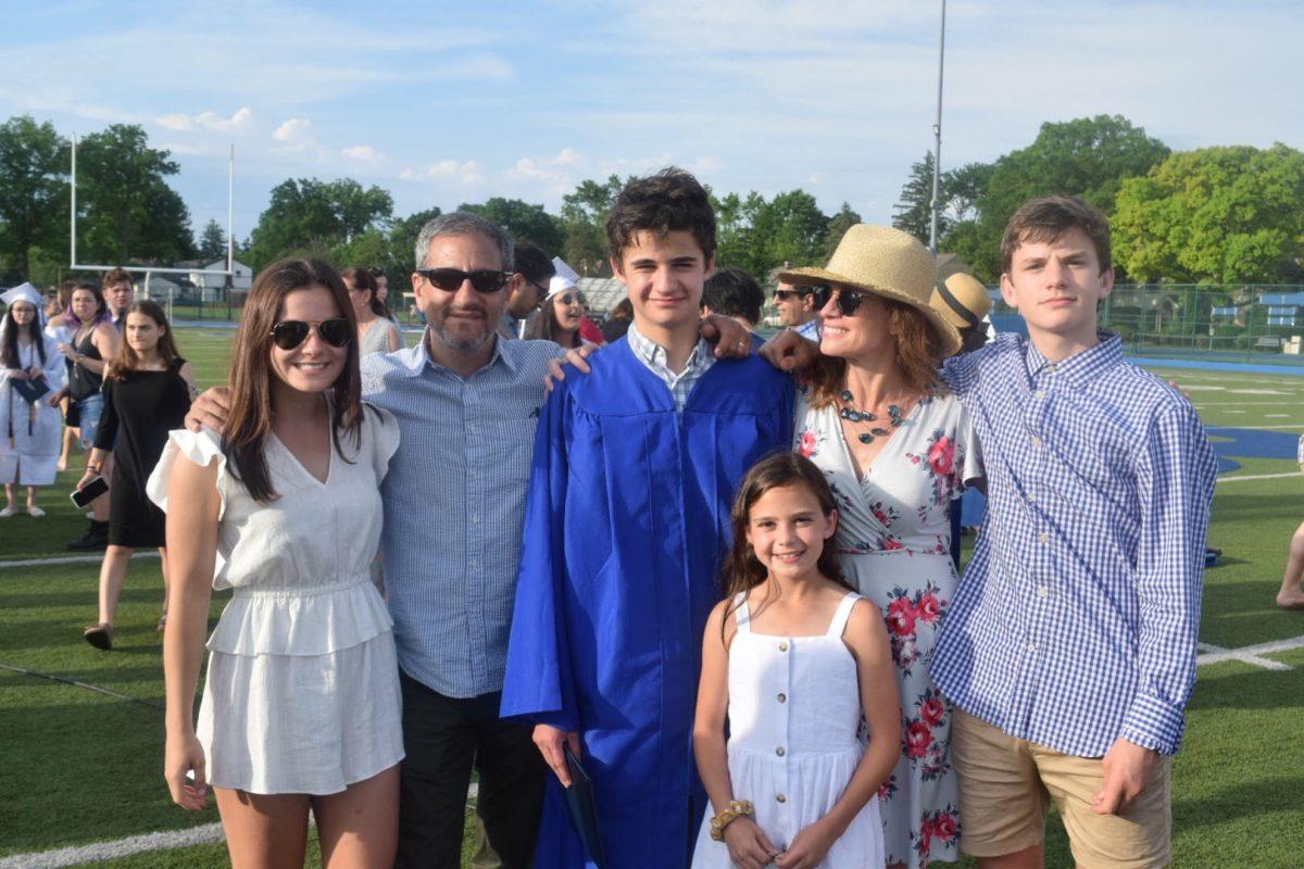 Eli Weinstock stands with his family at his Bexley High School graduation in 2019. (Photo courtesy of Matthew Cohn)