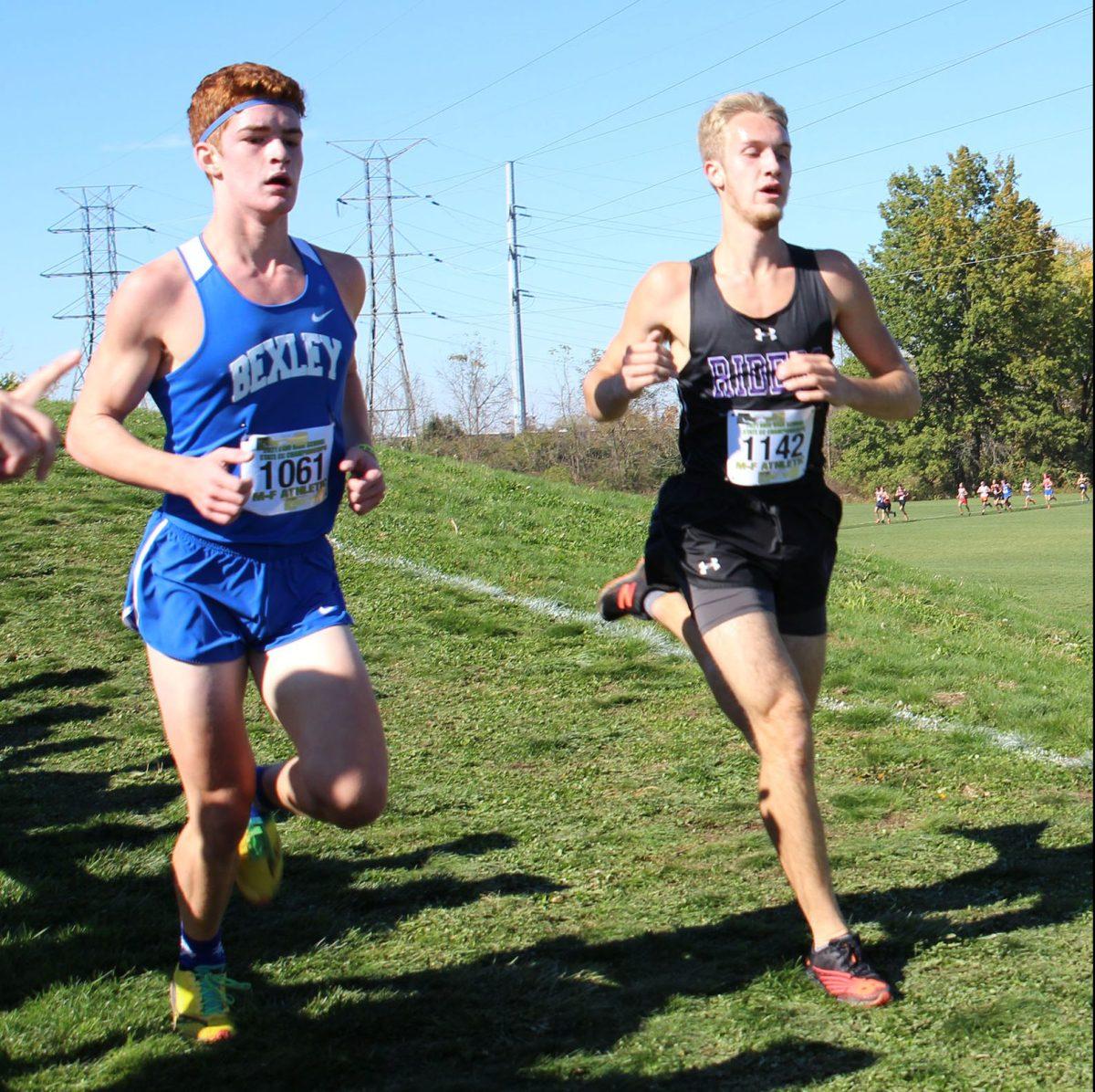 Junior John Laing passes his competitor at the state meet Nov. 6. (Photo by Gigi Lewis)