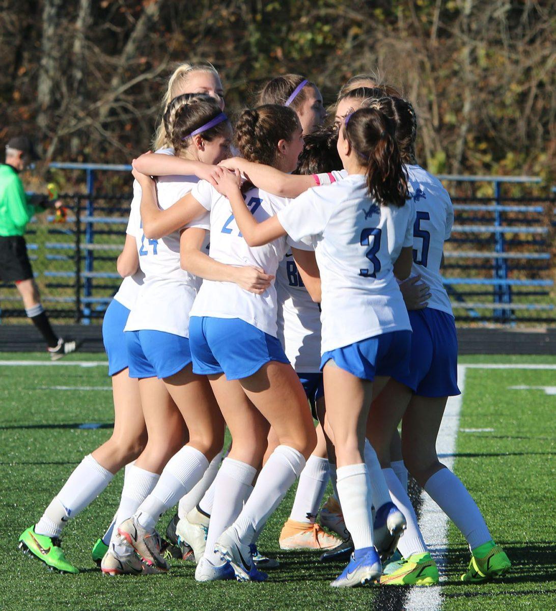 The girls soccer team celebrates following their win over Fairfield Union at the regional final game Nov. 6. (Photo by Leah Baumann) 