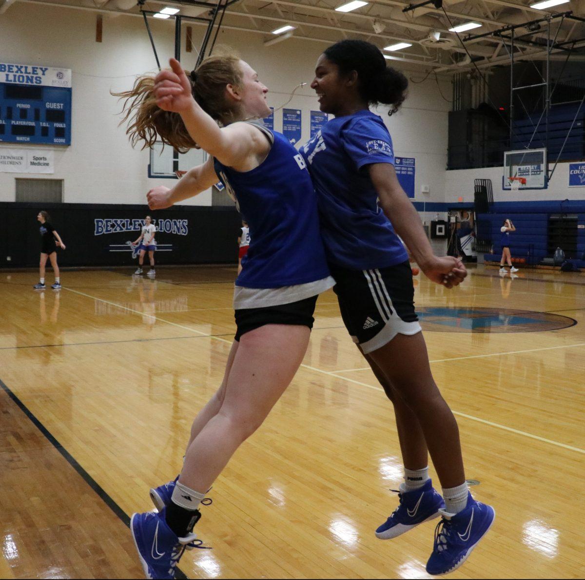 Juniors Sydnie Smith and Madison Ingram celebrate at practice. (Photo by Carolyn Islay)