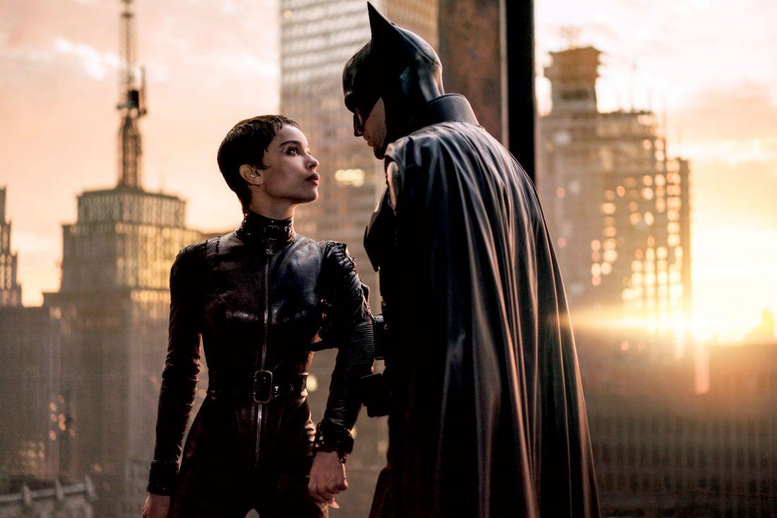 Catwoman (Zoë Kravitz) and Batman (Robert Pattinson) stare into each other’s eyes moments after he performs a daring rescue and escape. (Fair Use Vogue)