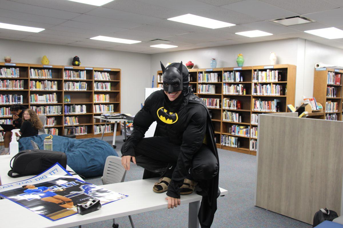 Senior Jonah Smith poses in his Batman costume for Blackout day. (Photo by Jonah Young)
“I’m just really excited for this Academy game, I really wanted to bring my school spirit back," Smith said. "I planned it last night, I thought I kind of want to be Batman tomorrow. I went to Party City, and now I’m here.”