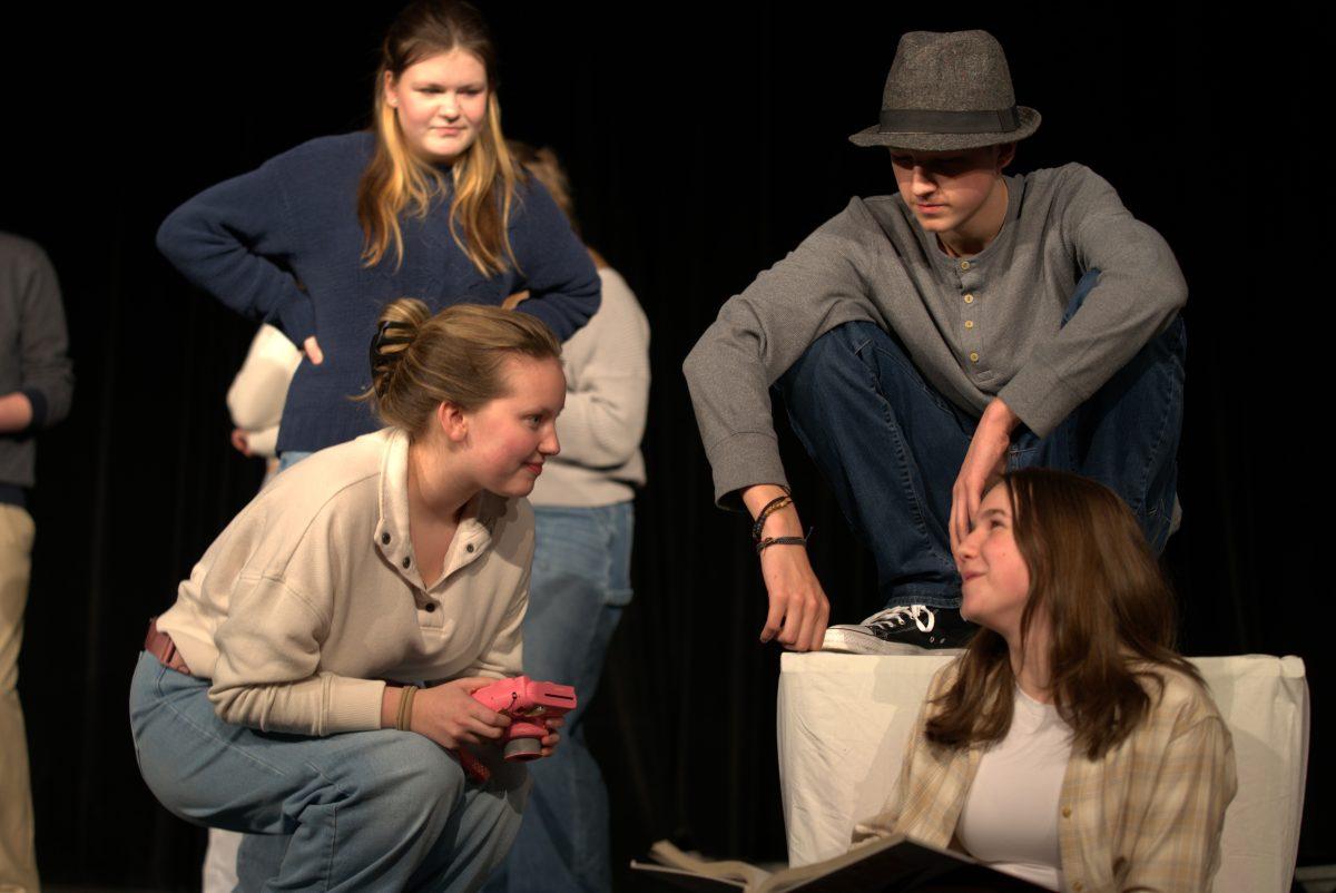 Senior Annabel Long (bottom right) performs “Chaos on Campus” with fellow castmates (clockwise from bottom left) freshman Annmarie Carleton, junior Leah Rogers and sophomore Ayden Downey. (Photo by Ruthie Gravelle)