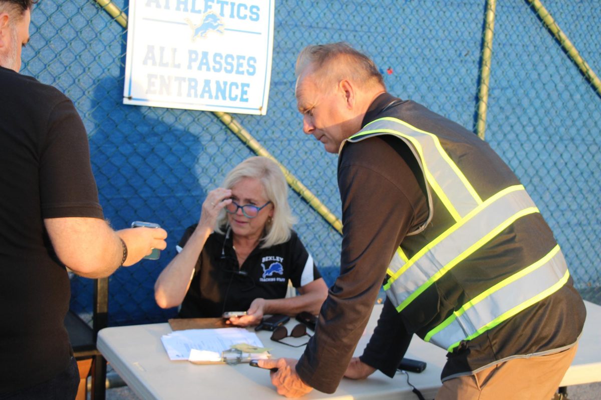 Director of Facilities Harley Williams helps Bexley staff enforce new sporting event rules.