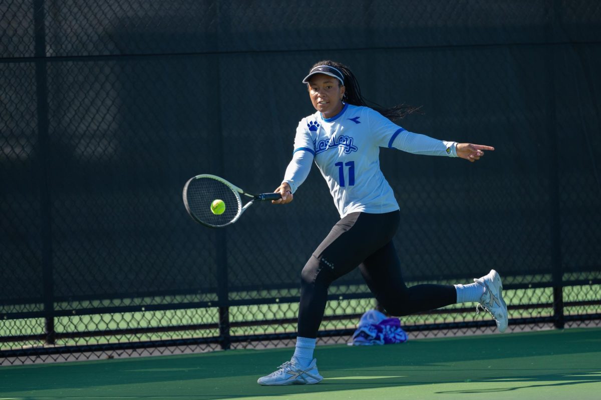Junior Amiya Bowles hits the ball during a rally in the state semi-final match at the The College of Wooster Oct. 18. (Courtesy of Mike Nolan)