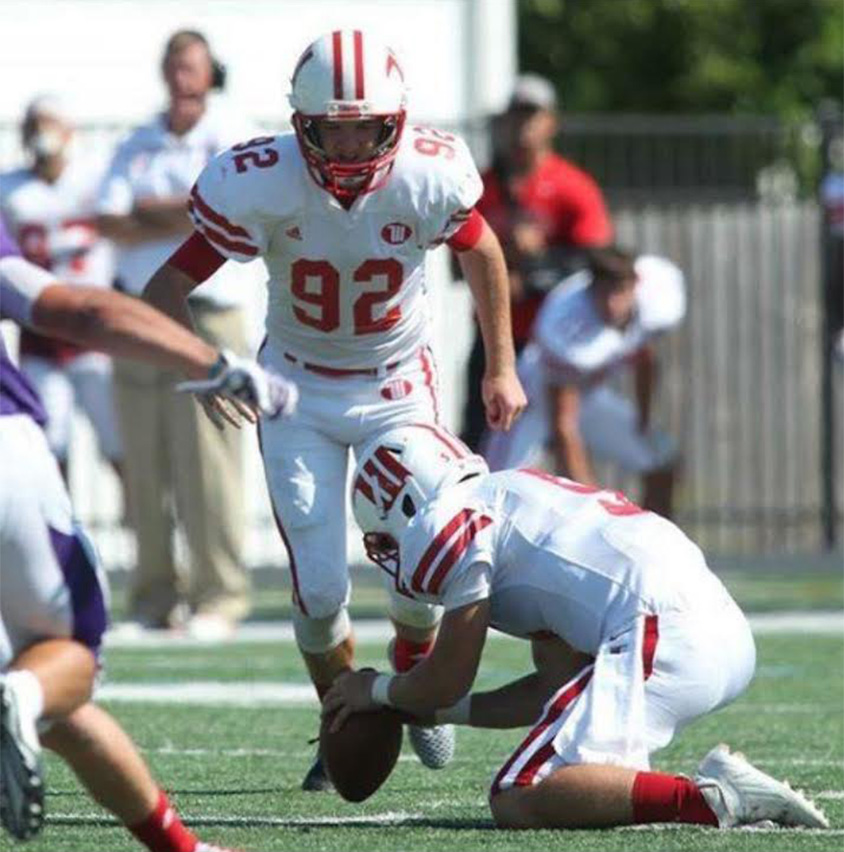 Boys golf, basketball and tennis coach Will Gingery preparing to kick the ball between the uprights for the Wittenberg Tigers as a college student. (Courtesy of Will Gingery)