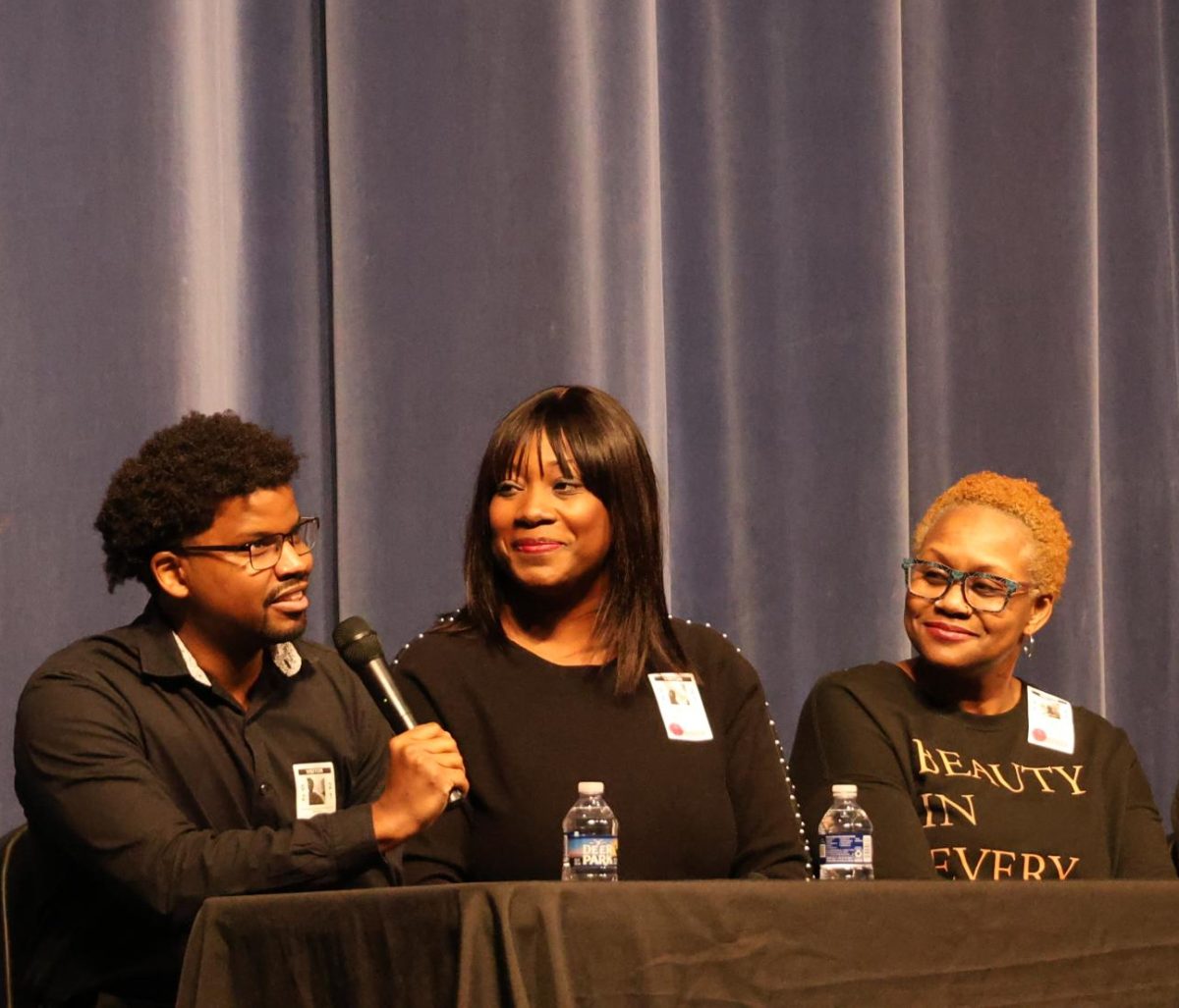 Ceylon Wise, Ashley Wise and Lachandra Baker speak to the high
school as members of the panel at the Black History Month assembly
Friday, Feb. 21.
