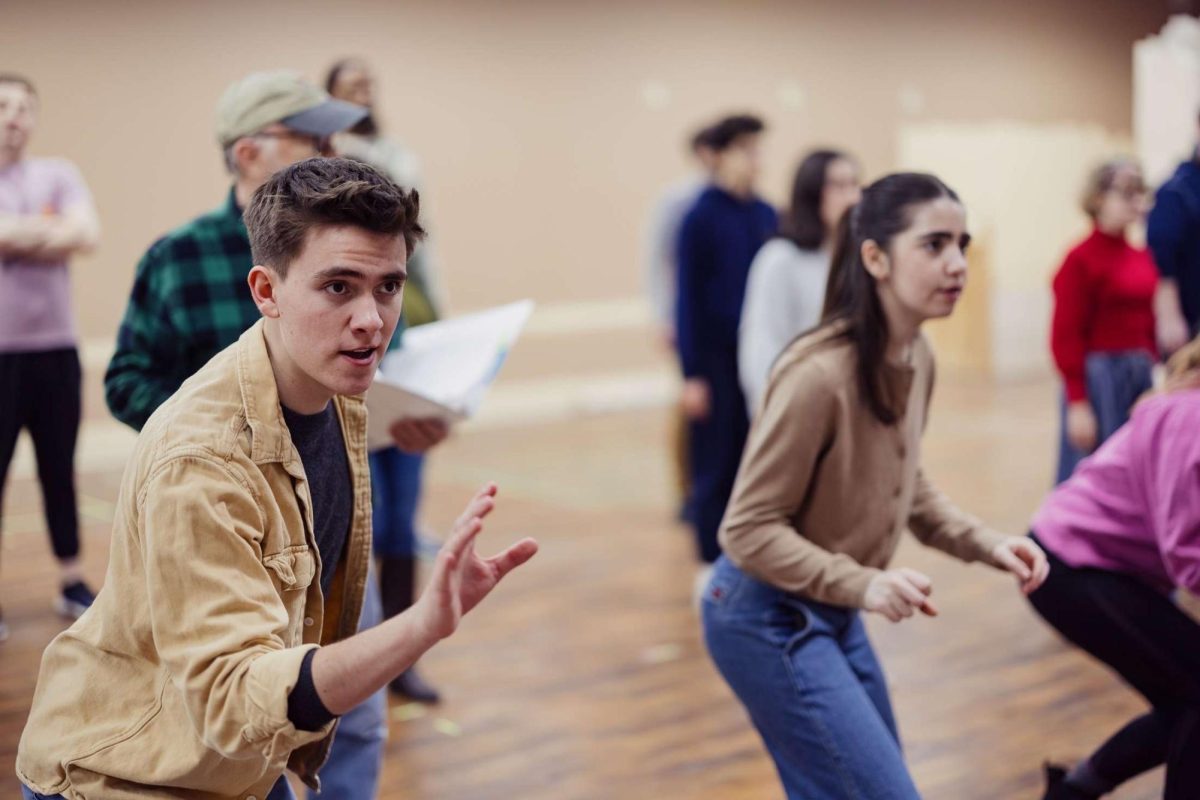 Senior Jakob Robinson and junior Lucy Robinson rehearse for the musical “Into the Woods.” (Photo courtesy of Kyle Long)