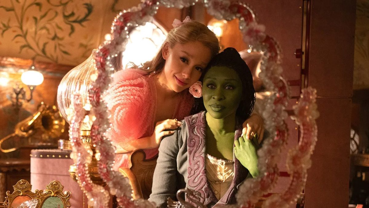 Glinda (Ariana Grande) shares a heartfelt moment with roommate Elphaba (Cynthia Erivo) after performing the song “Popular” in the movie adaptation of the hit Broadway musical
“Wicked.”