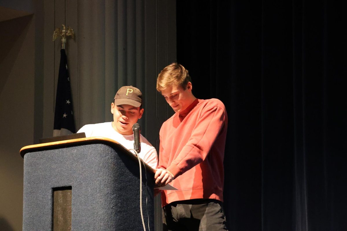 Seniors Jacob Bednar and Rowan Crilly speak as members of the Culture Climate Council at the No Place for Hate assembly Nov. 13.