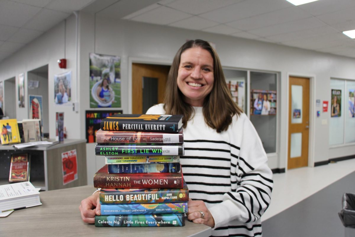 English teacher Jamie Hayes with
books she has read this past year.