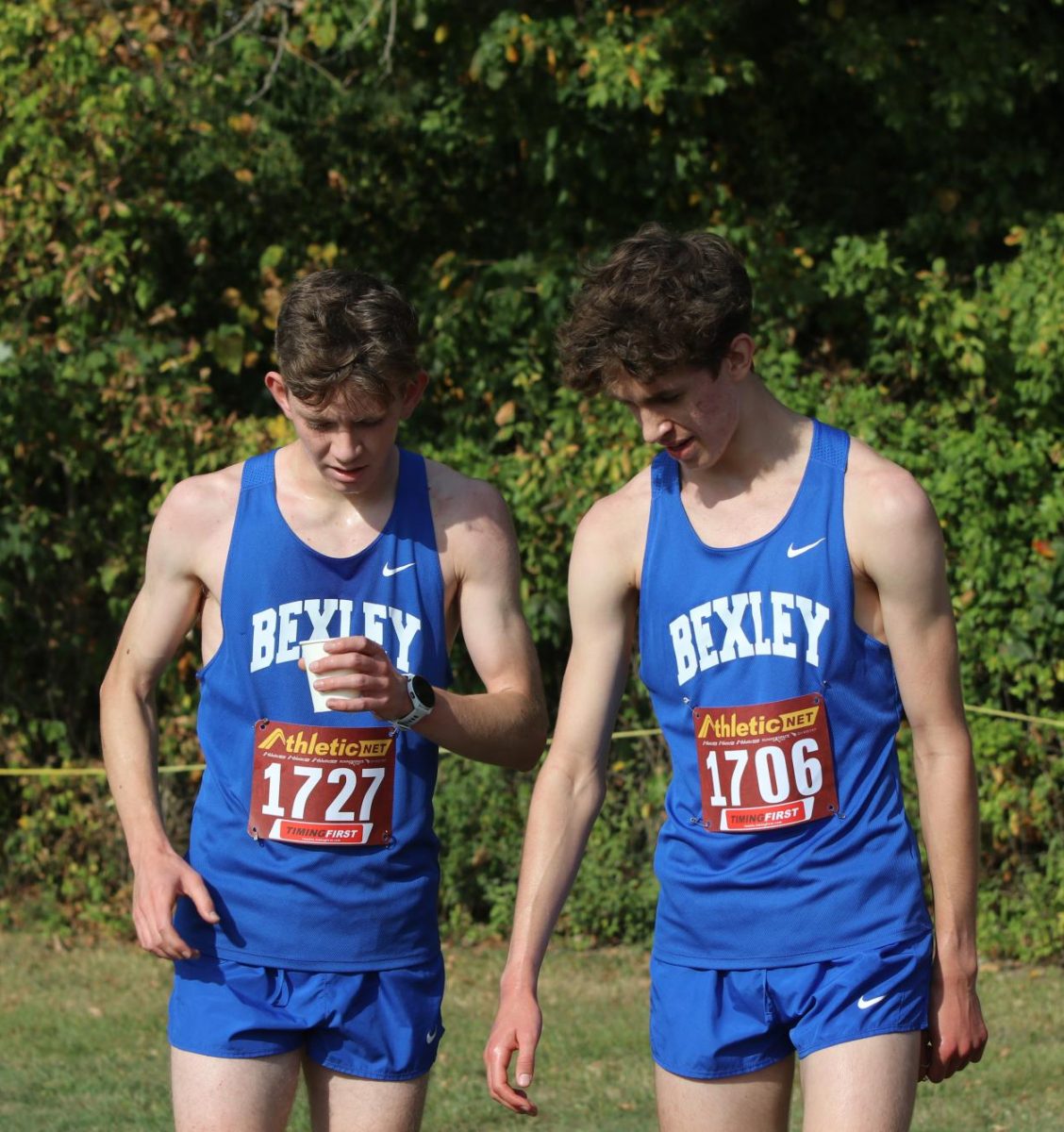 Senior Everett Lynch and sophomore Owen Comes converse before their race.