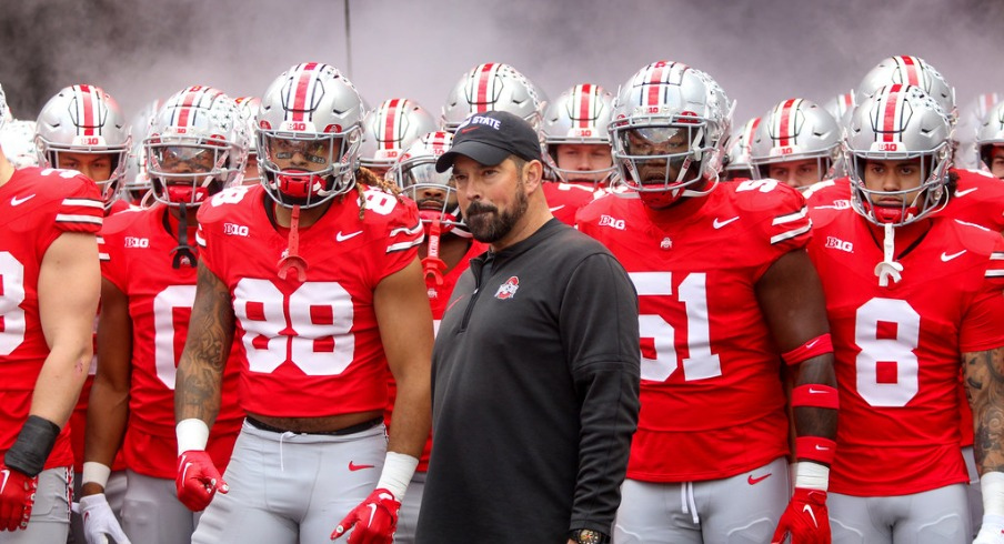 Head coach Ryan Day stands in front of the Ohio State Football Team (fair use Sports Illustrated)