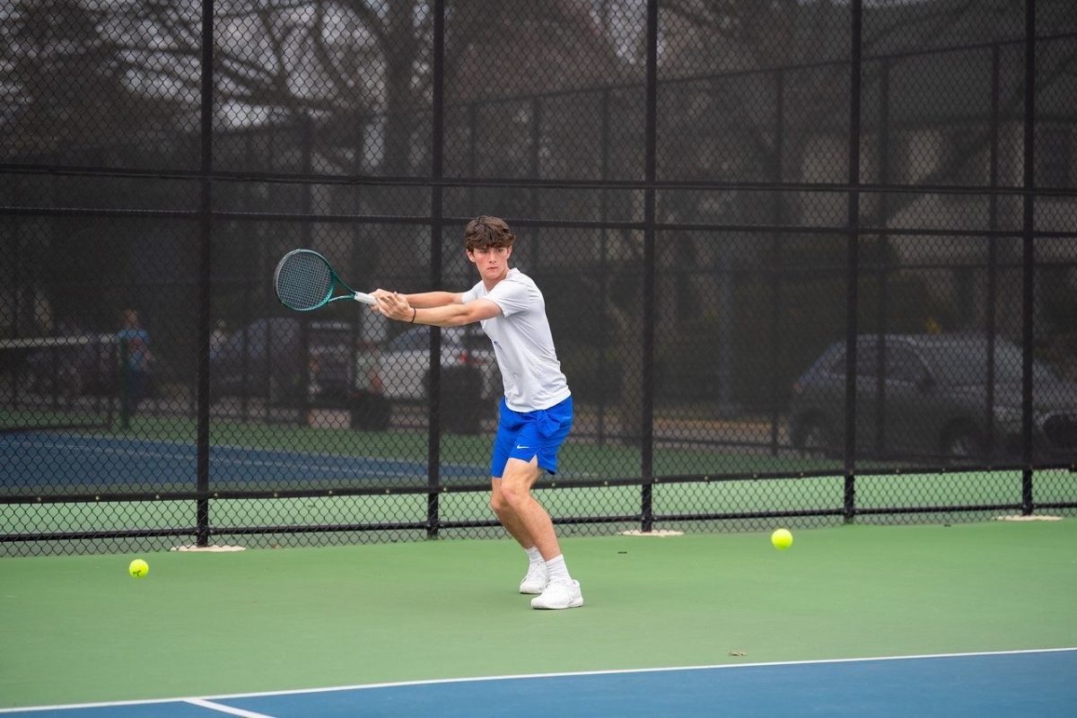 Junior Henry Lessard plays singles
for a varsity tennis match. (Photo courtesy of Henry Lessard)