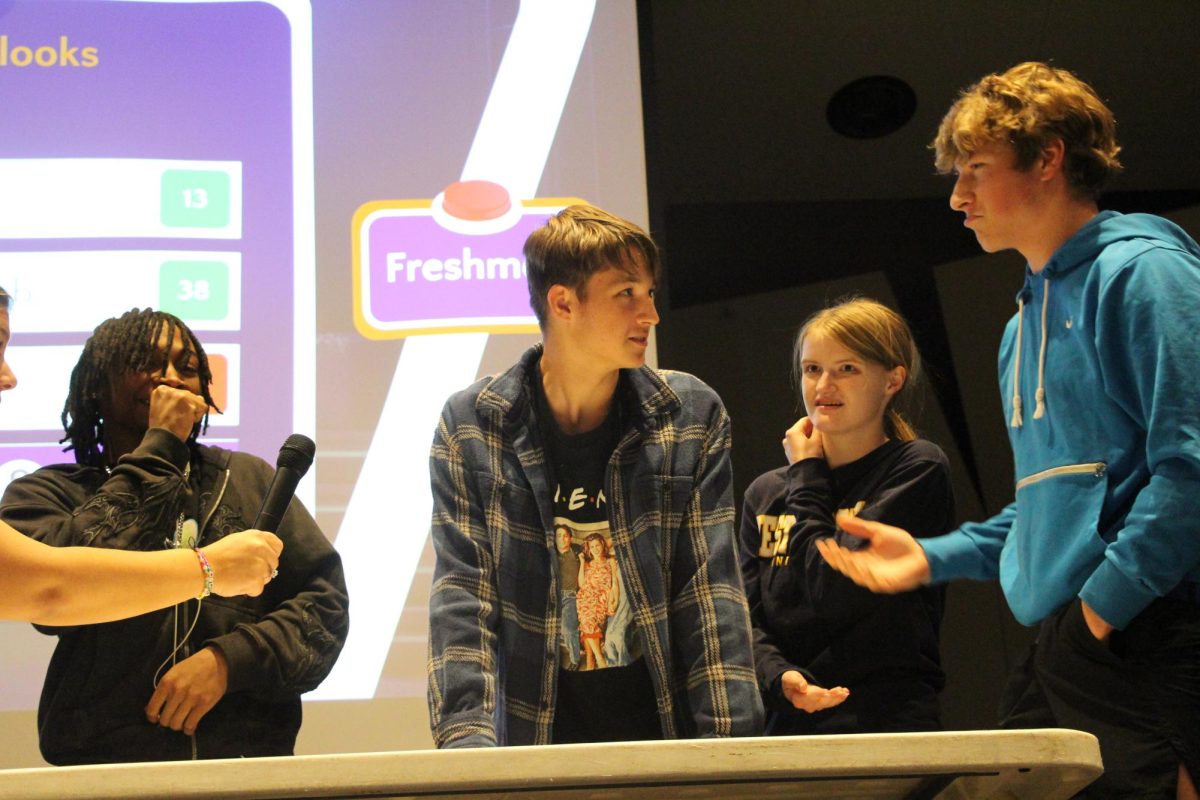 Seniors Kahlil Harvey, Ayden Downey, Izzy Skoog and Everett Tetzloff complete in Family Feud at the Renaissance Club rally Oct. 15. 