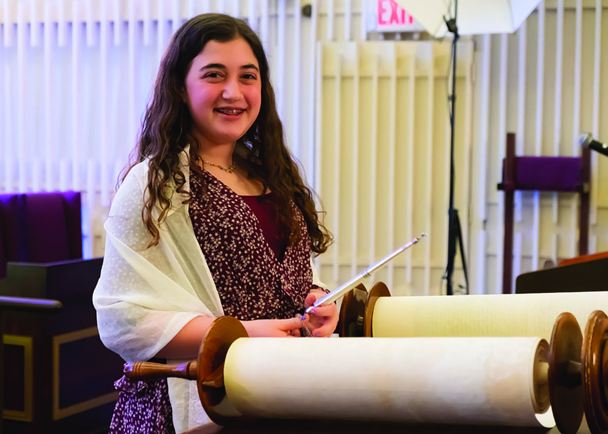 Junior Dafna Skolnik reads the Torah at her bat mitzvah when she was 13 years old. (Courtesy of Dafna Skolnik)