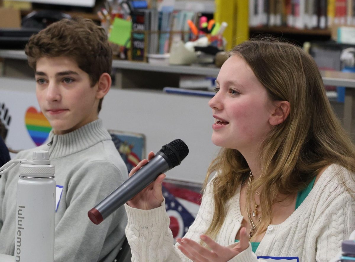 Junior panelist Annmarie Carleton speaks at the first Champion Chat meeting Wednesday, Nov. 19 in the high school library.