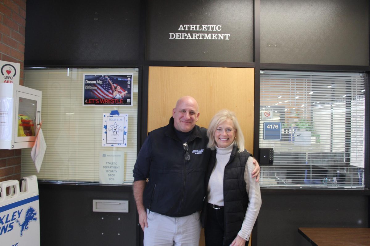 Eli Goldberger and Sharleen Stanley
pose outside the athletic office Feb. 27.