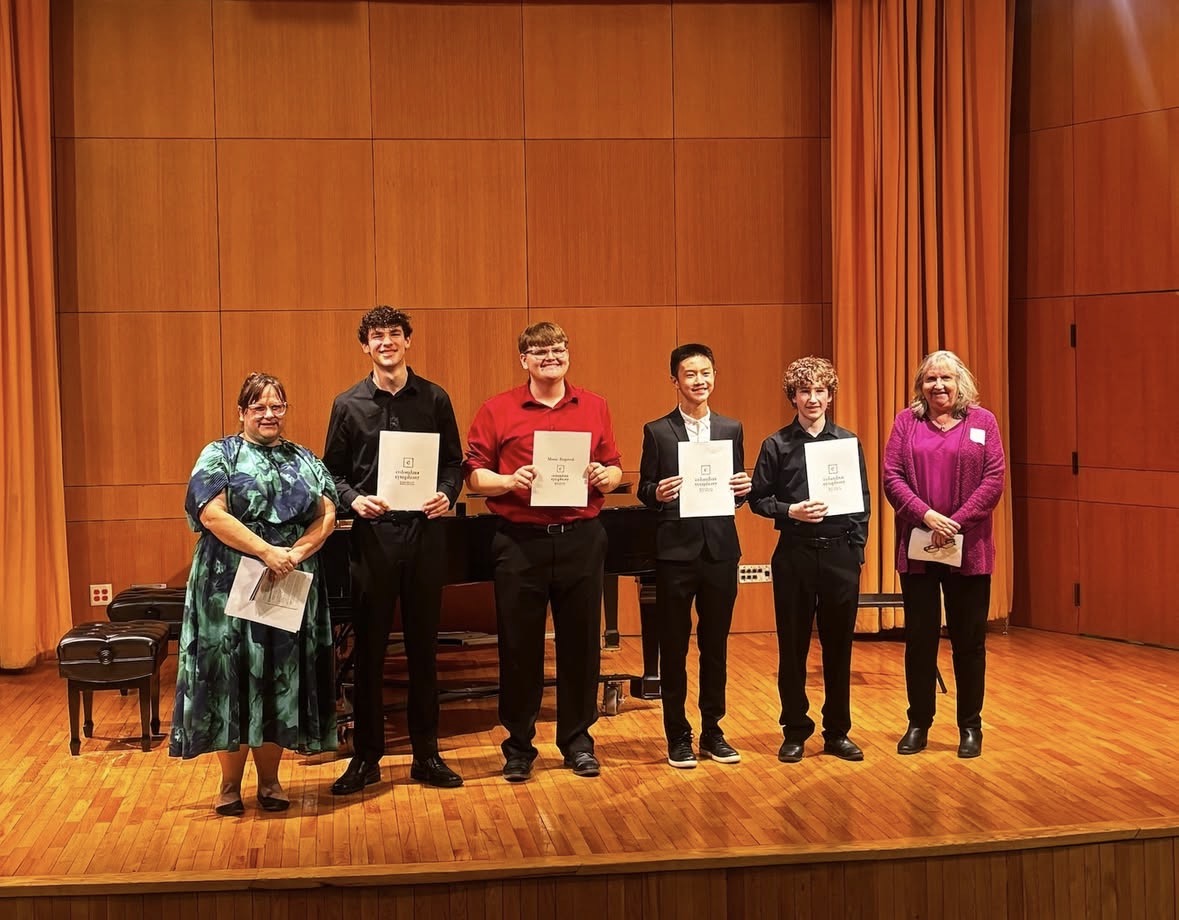 Sophomores Jonah Davis and Everett Martin (second and third from left) pose with the certificates at the Capital University Conservatory of Music. ( Courtesy of Columbus Symphony)