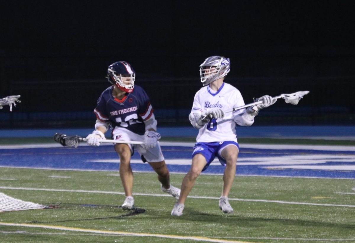 Junior Bren Puchta looks for open teammates to complete an offensive play against Grove City March 28.