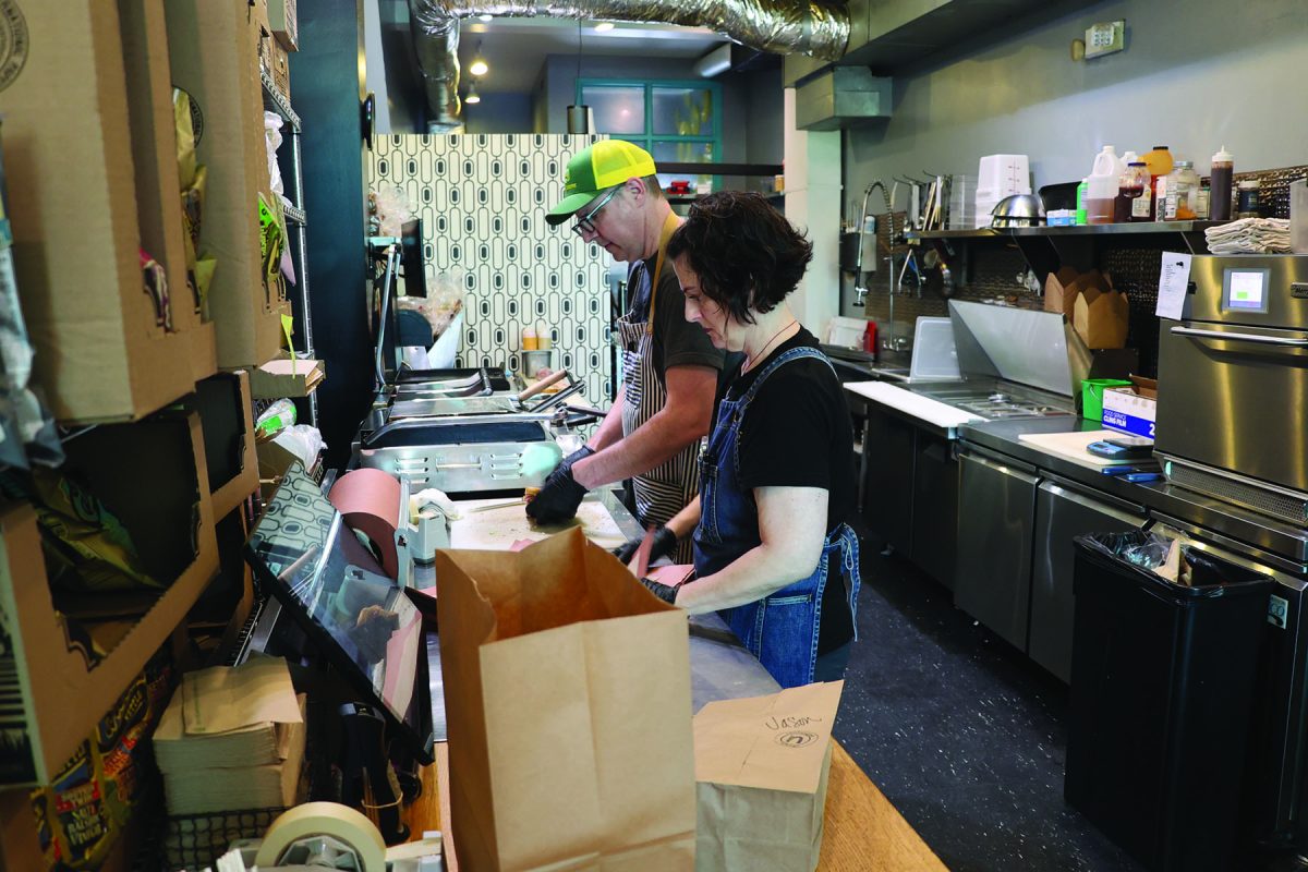 Owners Eric and Laura Dennison fulfill an order at Newfangled Kitchen.