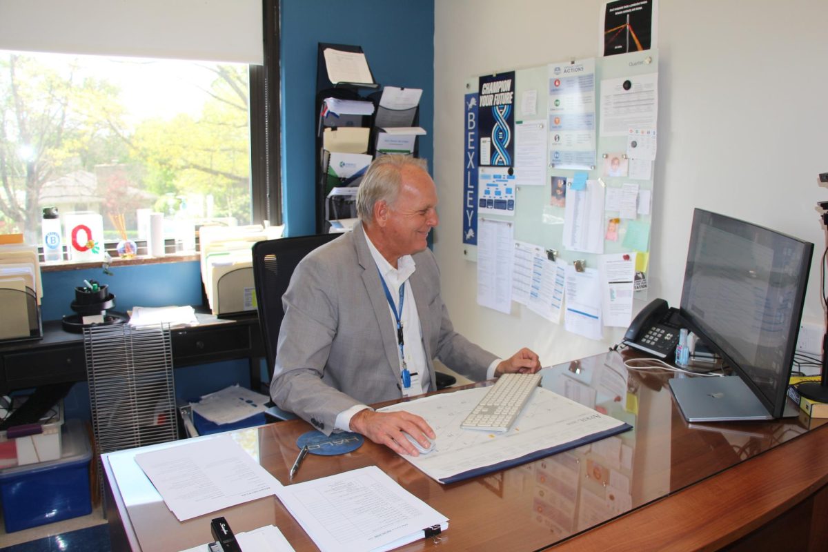 Director of Facilities and Operations Harley Williams works on his computer in his office.