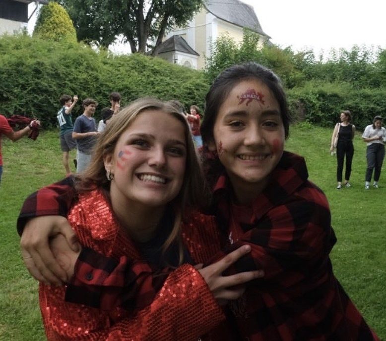 Sophomore Neve McCutcheon hugs her Canadian friend Amelie Au-Pronovos at a CISV camp in Austria. (Photo courtesy of Neve McCutcheon)