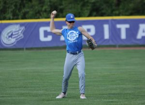 Senior Kyle Hagely throws to first base at practice Tuesday, April 28