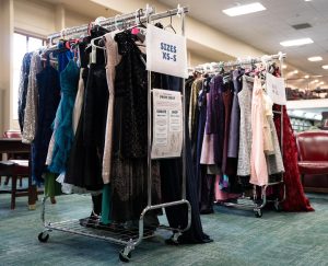 Donated prom dresses and suits hang on racks at the Bexley Public Library “Prom Swap” Sunday, April 19.